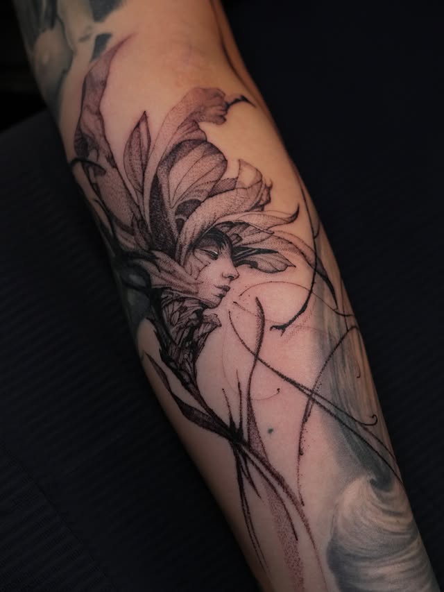 Close-up of flower headdress portrait forearm tattoo